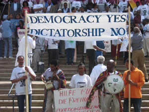 Photo from a march showing a banner that reads "Democracy: Yes, Dictatorship: No"